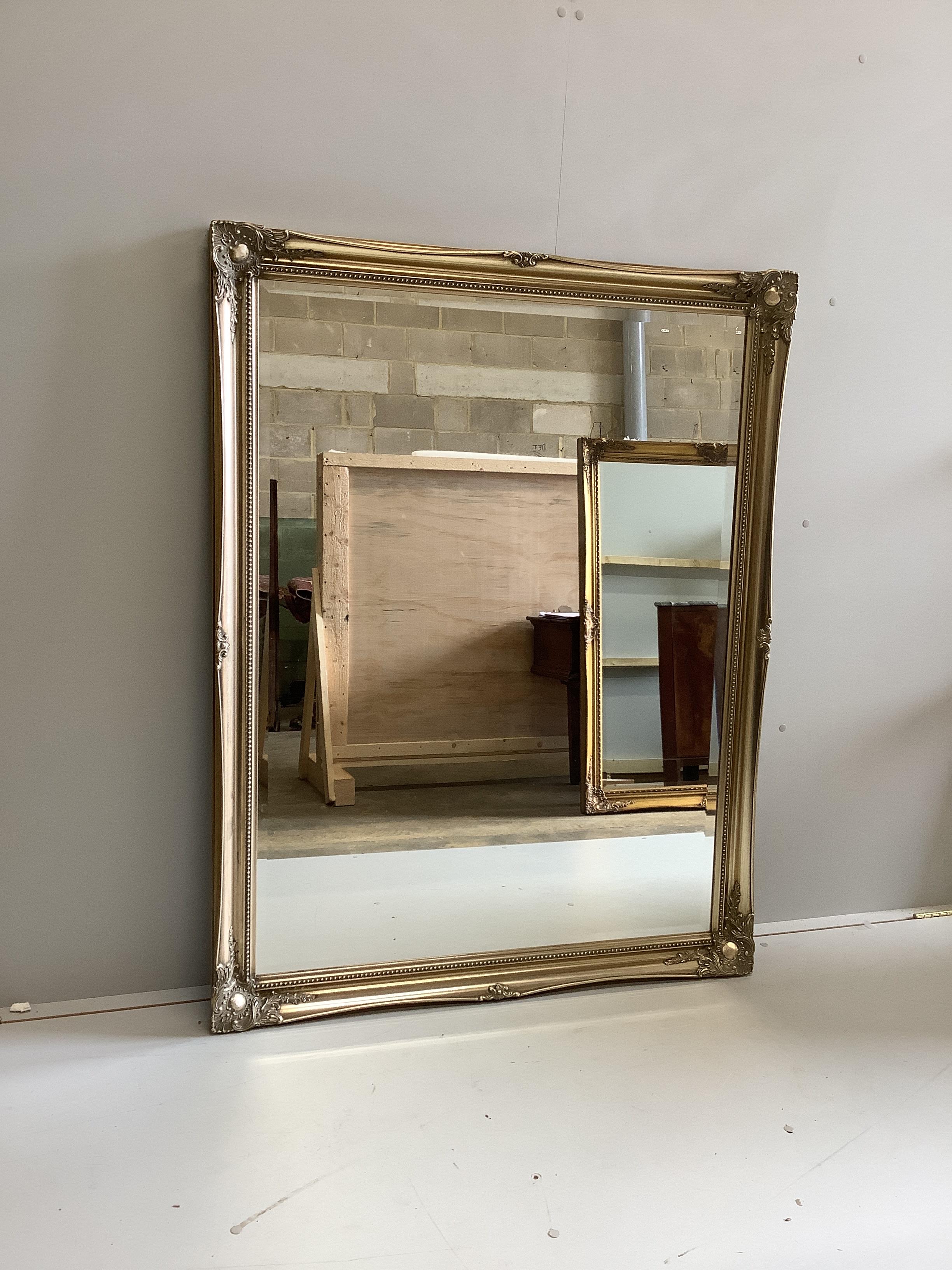 A Victorian style rectangular gilt framed wall mirror, width 106cm, height 137cm